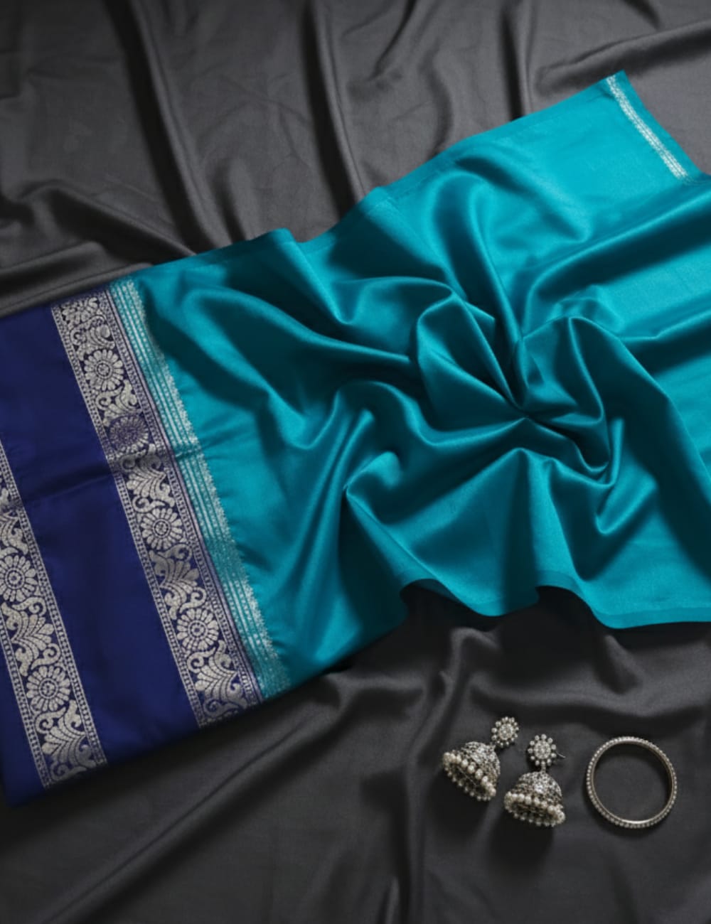 “Teal Crepe Silk Saree with Elegant Dark Navy Blue Border”