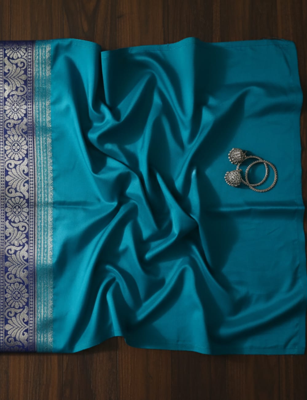 “Teal Crepe Silk Saree with Elegant Dark Navy Blue Border”