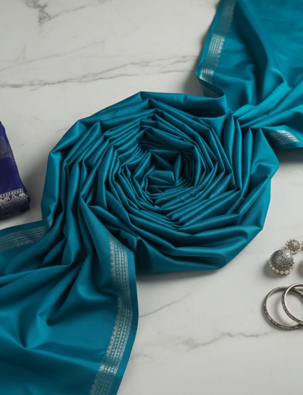 “Teal Crepe Silk Saree with Elegant Dark Navy Blue Border”