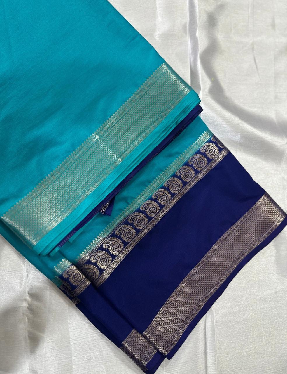 “Teal Crepe Silk Saree with Elegant Dark Navy Blue Border”