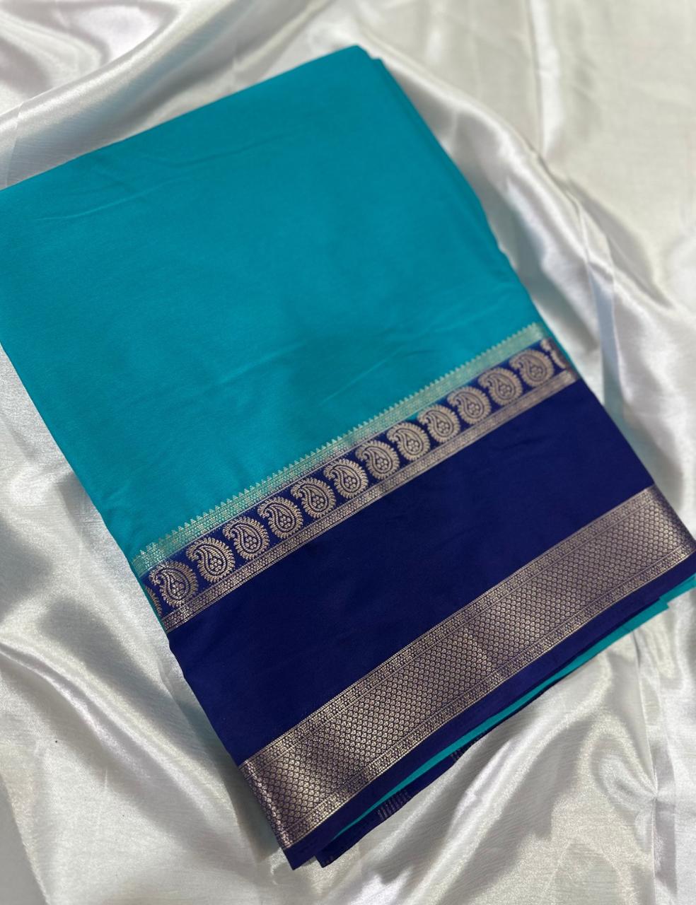 “Teal Crepe Silk Saree with Elegant Dark Navy Blue Border”