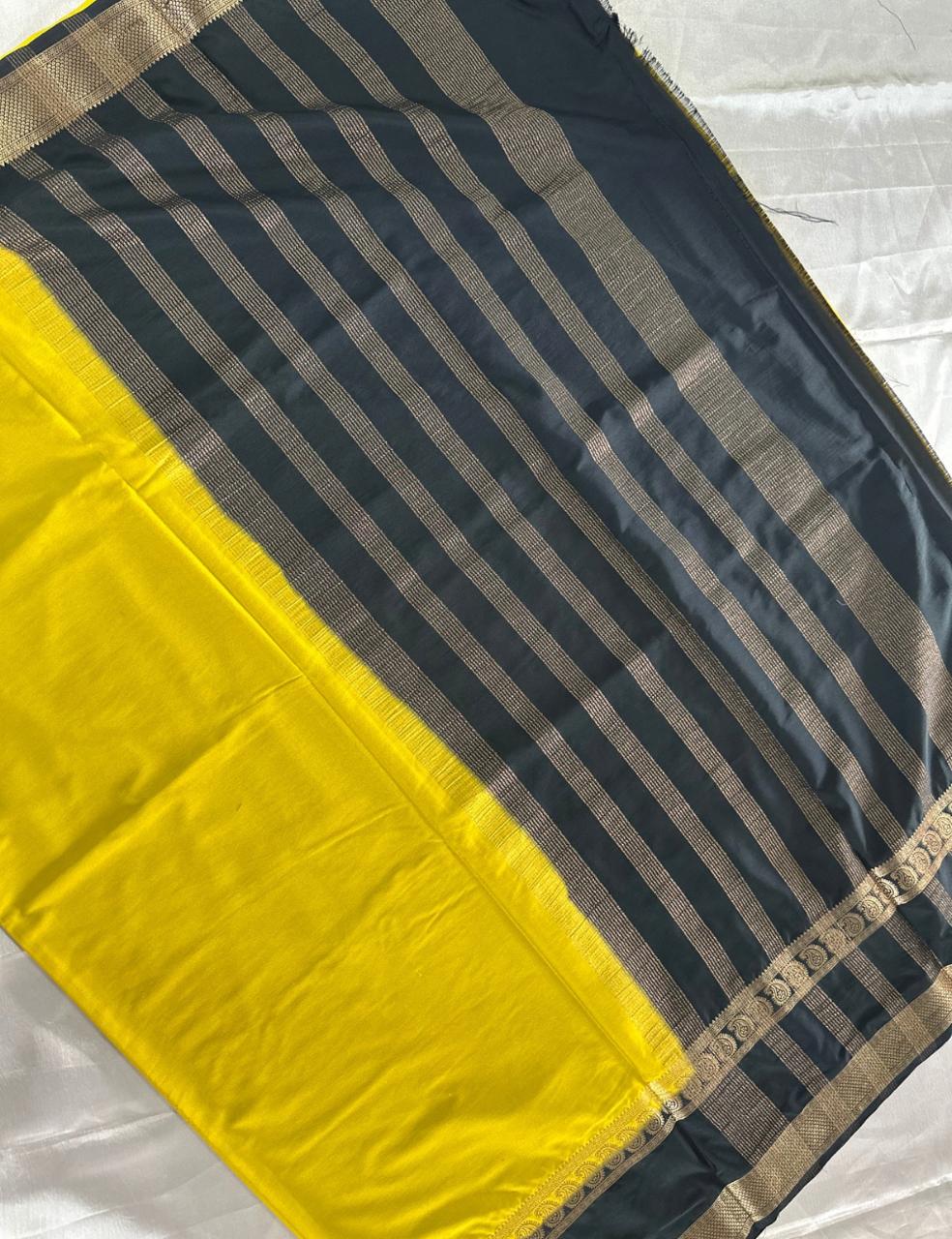 LEMON YELLOW AND NAVY BLUE CREPE SILK SAREE WITH A GOLDEN ZARI BORDER