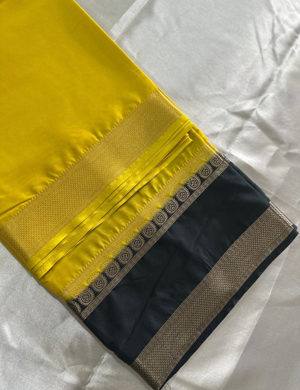 LEMON YELLOW AND NAVY BLUE CREPE SILK SAREE WITH A GOLDEN ZARI BORDER