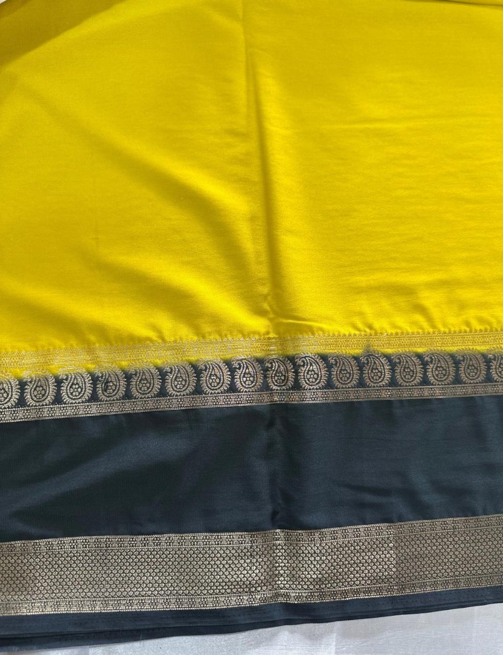 LEMON YELLOW AND NAVY BLUE CREPE SILK SAREE WITH A GOLDEN ZARI BORDER