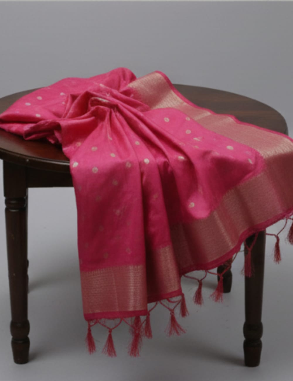 “Elegant Cream Tassar Silk Saree with Golden Woven Motifs and Tassel Border”