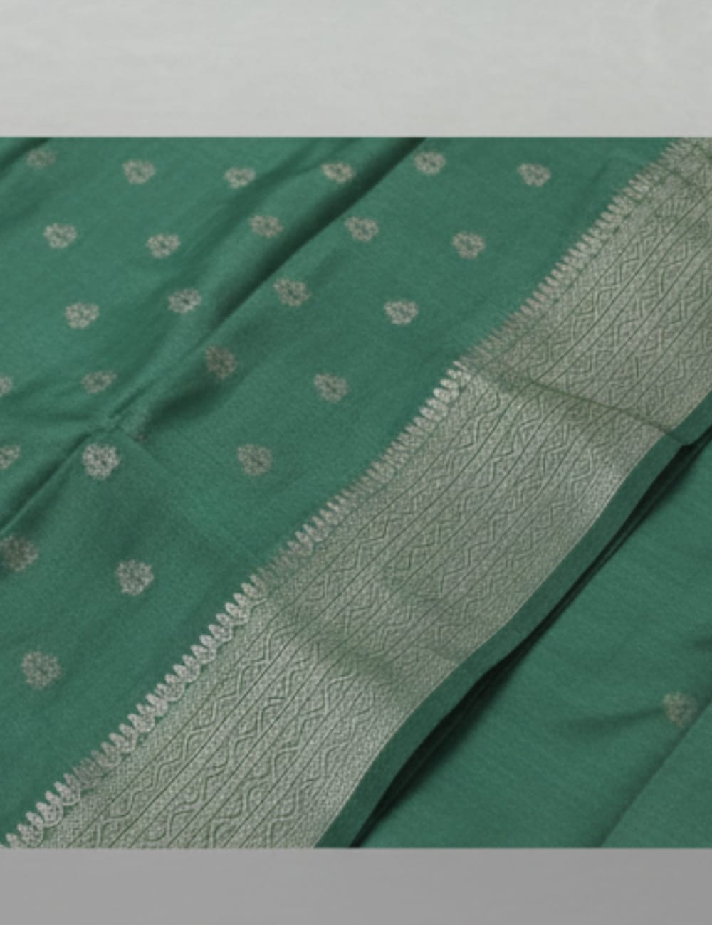 “Elegant Cream Tassar Silk Saree with Golden Woven Motifs and Tassel Border”