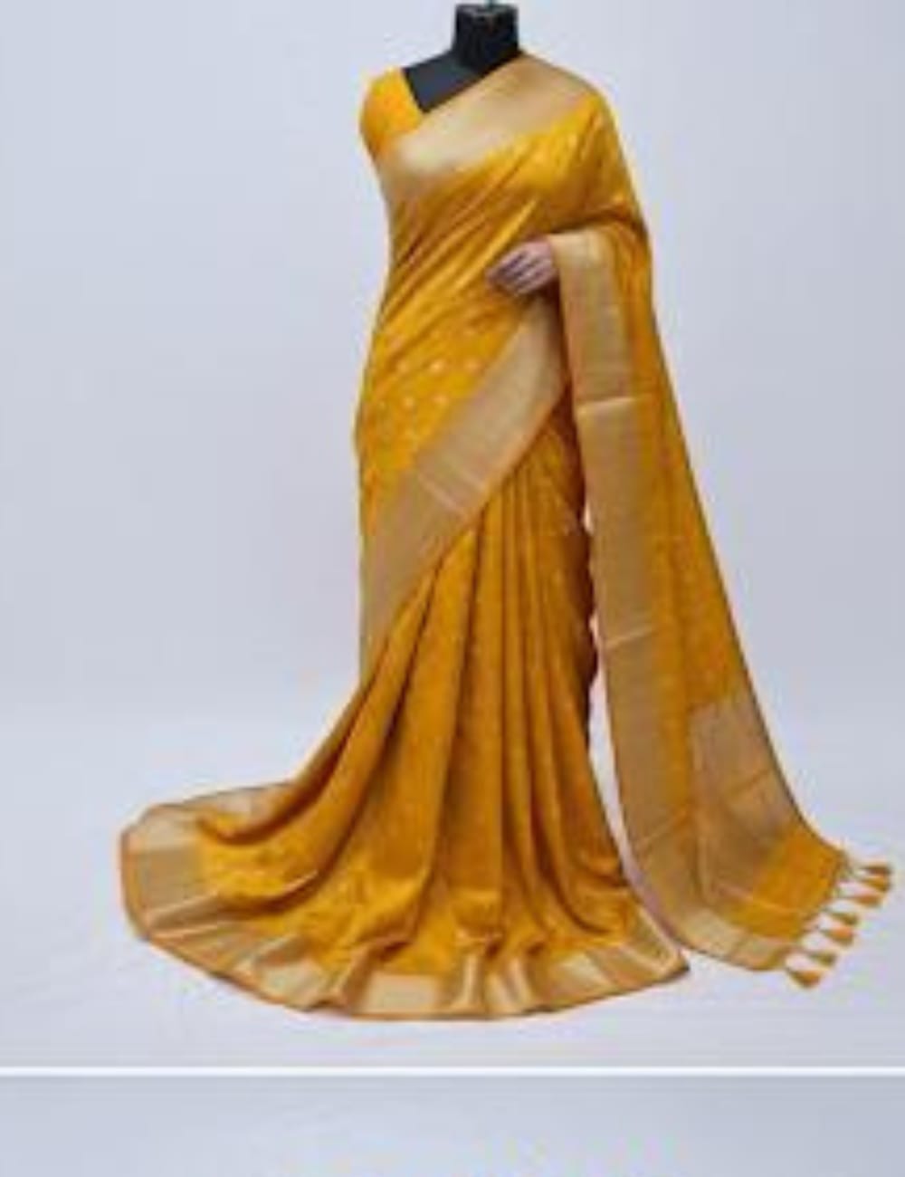 “Elegant Cream Tassar Silk Saree with Golden Woven Motifs and Tassel Border”