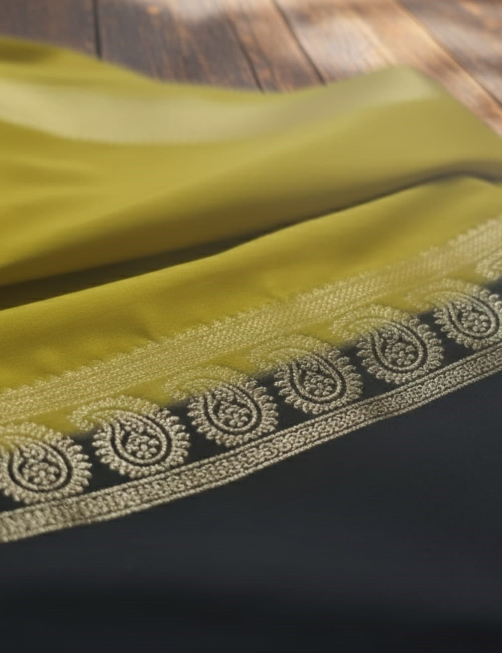 LEMON YELLOW AND NAVY BLUE CREPE SILK SAREE WITH A GOLDEN ZARI BORDER