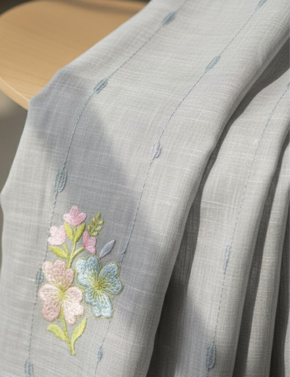 “Elegant Gray Handloom Saree with Floral Embroidery & Tassel Charm ”