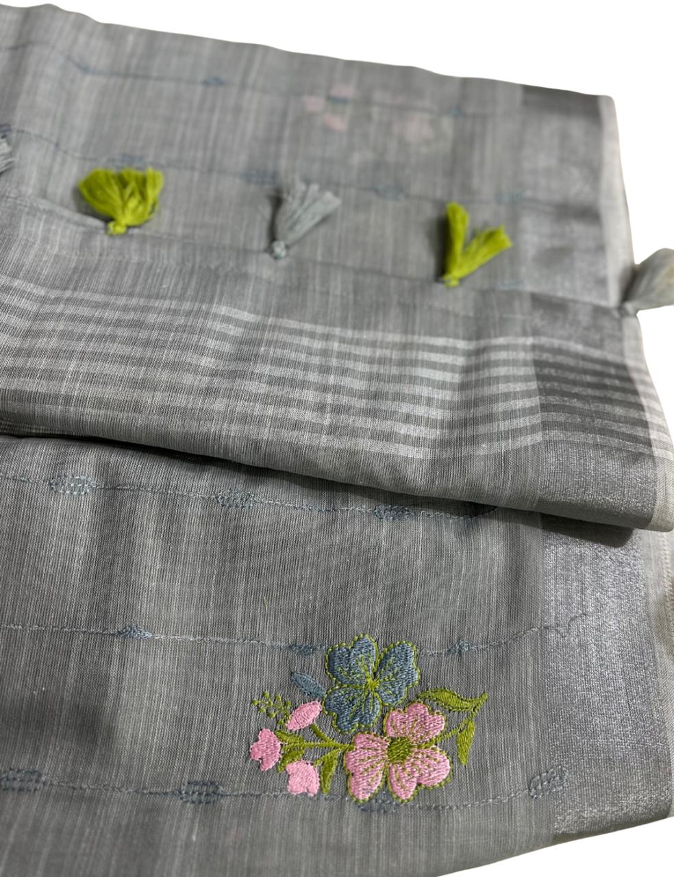 “Elegant Gray Handloom Saree with Floral Embroidery & Tassel Charm ”