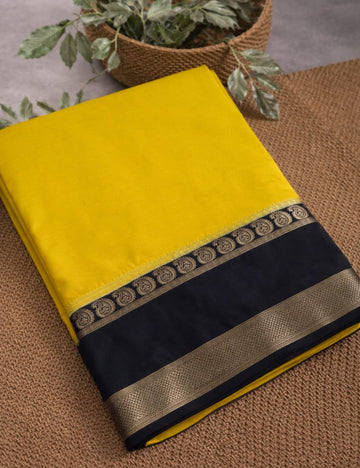 LEMON YELLOW AND NAVY BLUE CREPE SILK SAREE WITH A GOLDEN ZARI BORDER