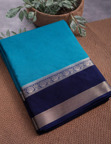 “Teal Crepe Silk Saree with Elegant Dark Navy Blue Border”